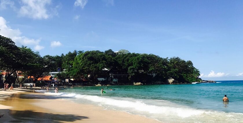 A mesmerising view of turquoise waters and lush green landscapes in Phuket, Thailand.