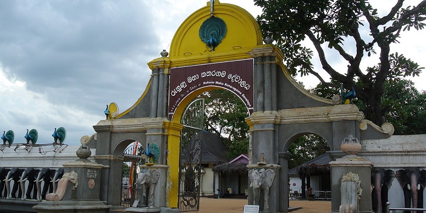 Entrance of Kataragama Temple, showcasing intricate architecture and vibrant decorations.