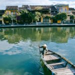 Kayak vietnam- Snapshot of a person in a boat steering the way in water.