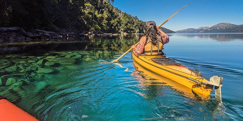 Beautiful snapshot of a woman Kayaking in the ocean—Things to do in Maldives for Couple