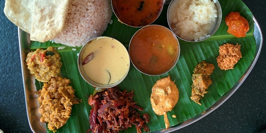Image of Kerala vegetarian food plate - find places to eat near the Mukkam waterfalls