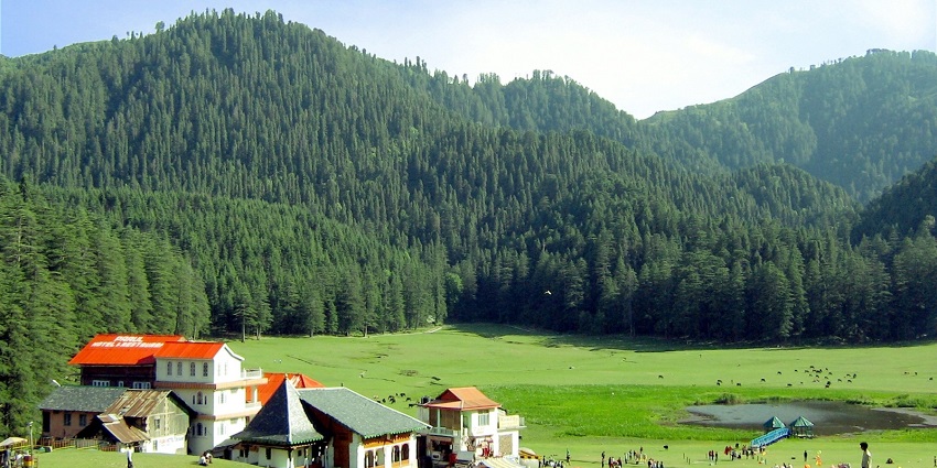 Scenic view of Khajjiar, a lush green meadow surrounded by tall pine trees - Hill stations near Kangra.
