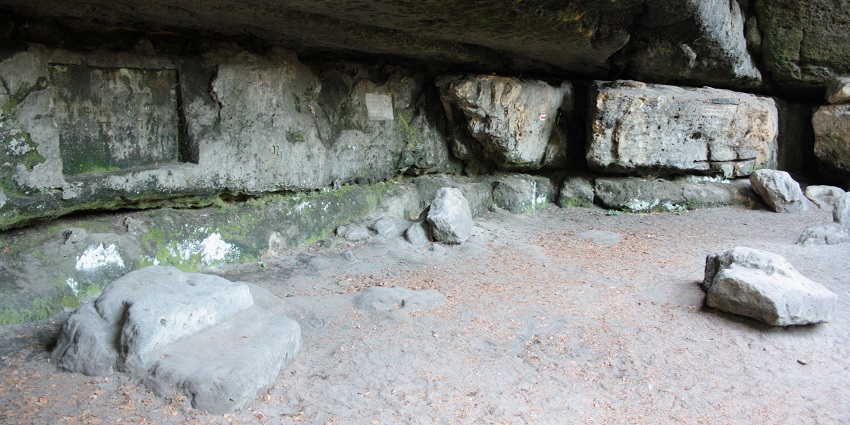 A lush cave entrance surrounded by greenery, ideal for exploring caves in Manipur.