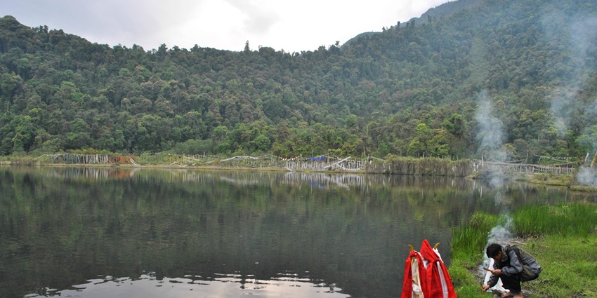A view of serene waters of Khecheopalri Lake, one of the top spots for paragliding in Pelling.