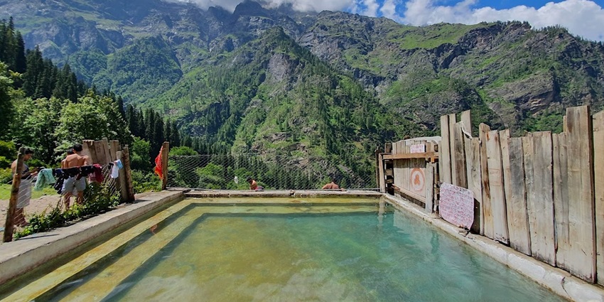Panoramic snapshot of the Kheerganga Hot spring and the lush green hills valley