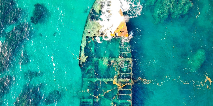 A picture of a ship wreck taken under water while scuba diving