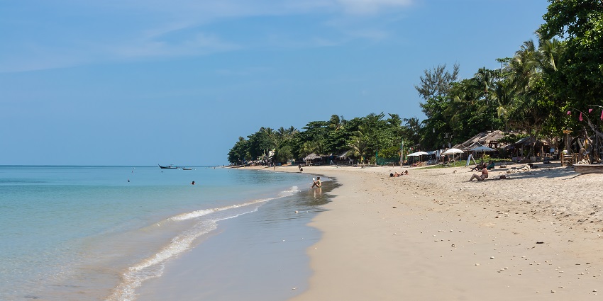 A panoramic view of the pristine sands and azure waters of Klong Dao Beach in the region.