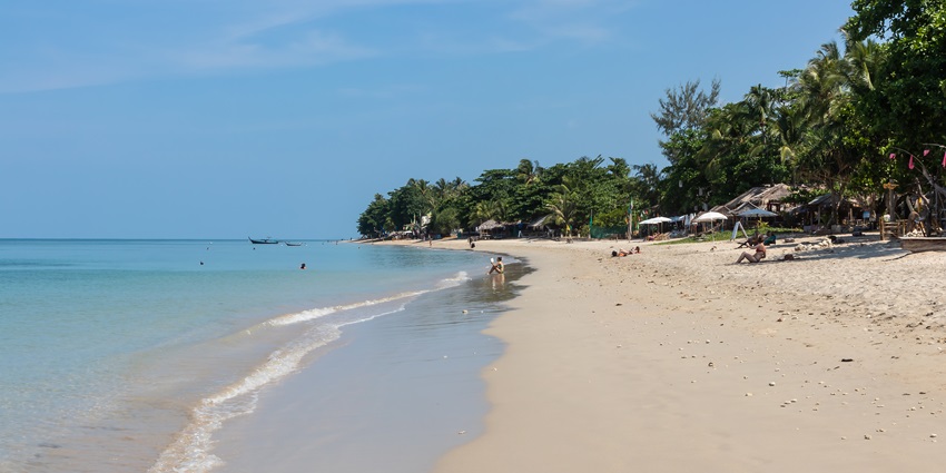 People spending their leisure time at Klong Khong Beach, one of the top Koh Lanta beaches.