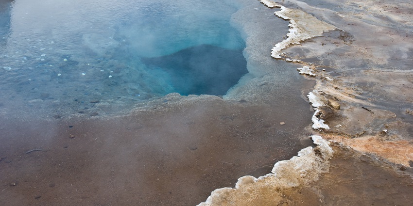 Scenic natural image of the spring flowing into the cold river down steam in krabi