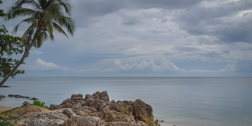 Big rocks decked on the sandy shores of Koh Lanta, a popular beach of this region.