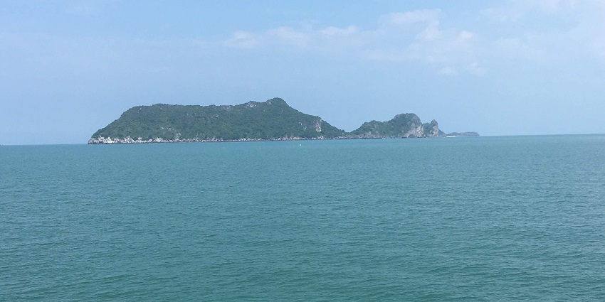 An island in the middle of the sea during day time