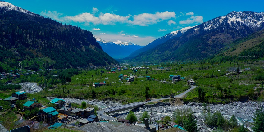 A panoramic view of the scenic village of Kothi in Himachal with a cover of greenery all around