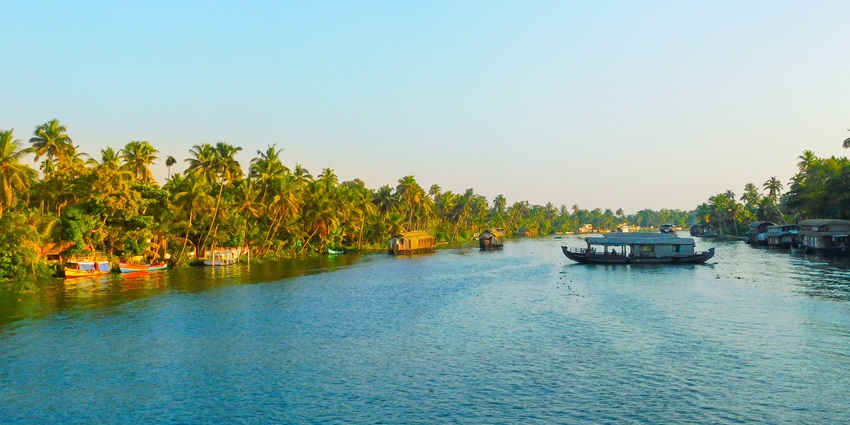 Beautiful view of the backwaters of Kerala from the idyllic houseboat amidst the trees