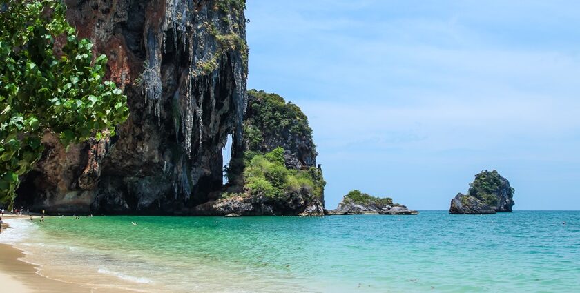 Scenic beaches in Krabi, Thailand with dramatic cliffs, turquoise waters, and white sand.