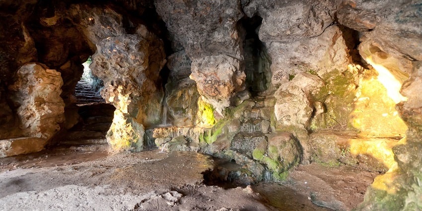 A historic rock grotto with rustic charm, offering a glimpse into ancient cave structures.