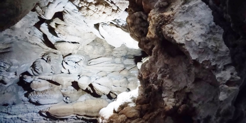 A picture of a cave's interior showing plenty of limestones formed on walls
