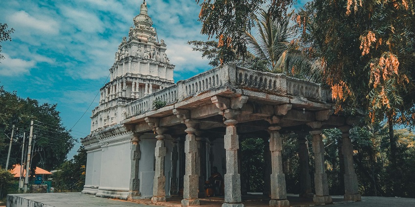 View of beautiful surroundings of a sacred place of worship with cloudy sky as backdrop.