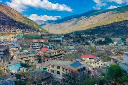 The beautiful Kullu town showing the houses along with mountains in the background