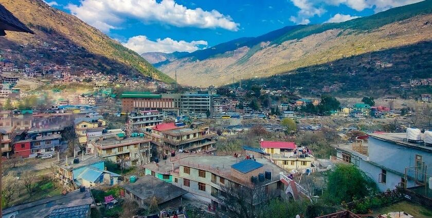 The beautiful Kullu town showing the houses along with mountains in the background