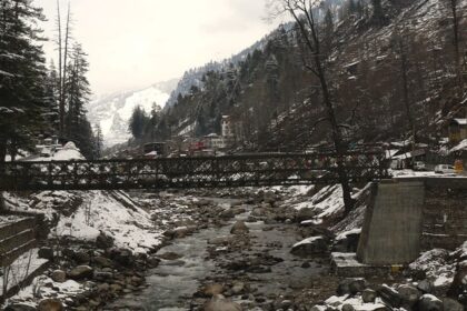 A scenic image of an iron bridge over a stream of river near Kalath Hot Spring.