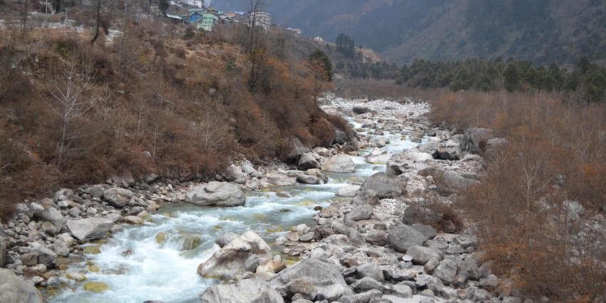 Experience the calmness and serenity of nature at the Lachung River in Sikkim, India.