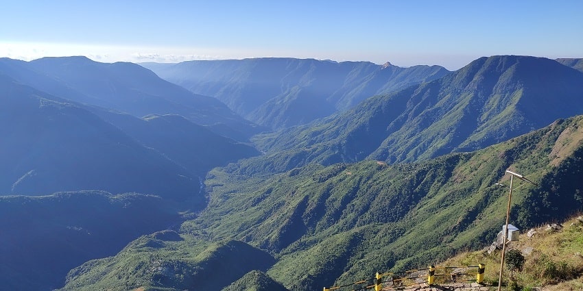 Laitlum Canyon with dramatic cliffs and sweeping views of rolling green hills and valleys.