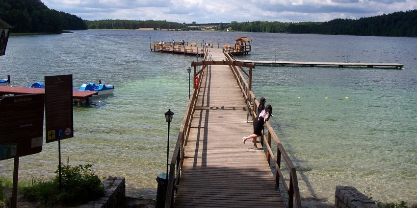 View of a lake, calm water and lush green surrounding - Places to visit in Silchar