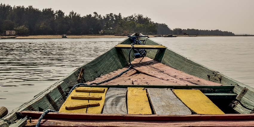 Chilika Lake in Odisha with expansive water, lush green shores - picnic places in Odisha.