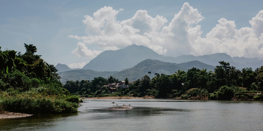 The panoramic Image of a Mountain Lake amidst the dense jungle and lush greenery