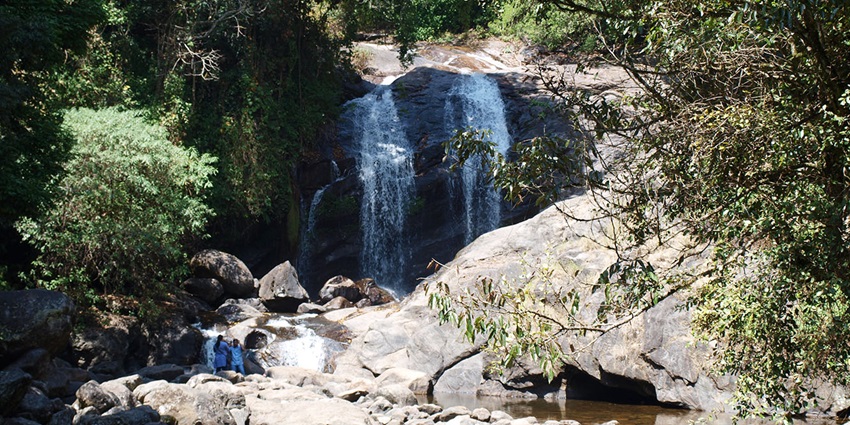 View of the stunning Lakkam Waterfalls, one of the places to visit near Munnar Wildlife Sanctuary.