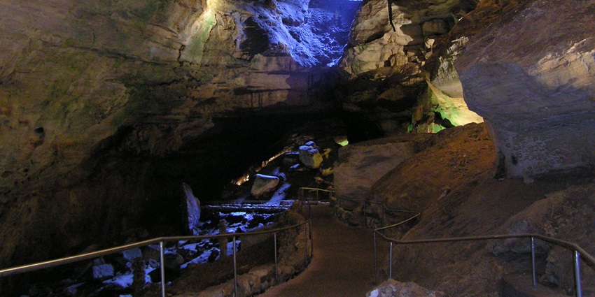 Limestone cave with intricate formations, a top attraction among caves in Cherrapunji.