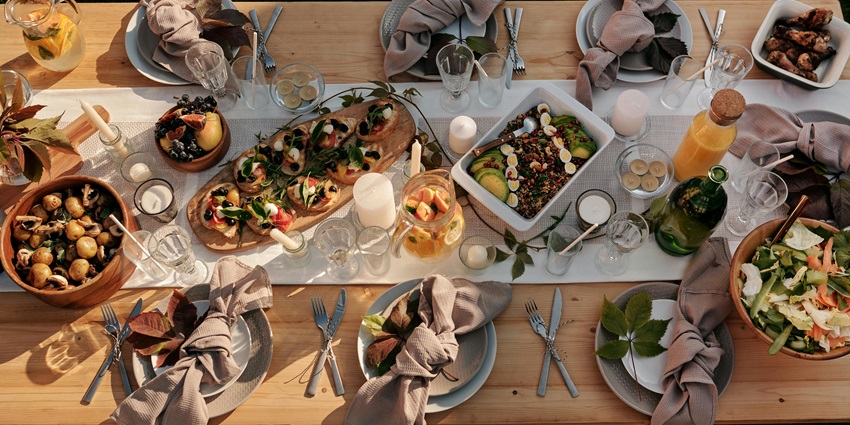 A picture of a savoury buffet of various international cuisines placed on a table