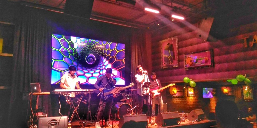 Singing in a cafe - live music and food - the best places to visit in Guwahati at night