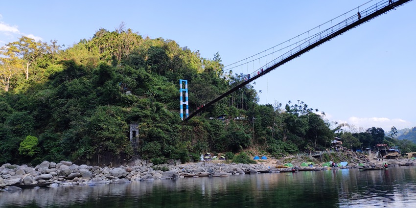 An image of the Dawki Bridge, a suspension bridge over the Umngot River in Meghalaya.