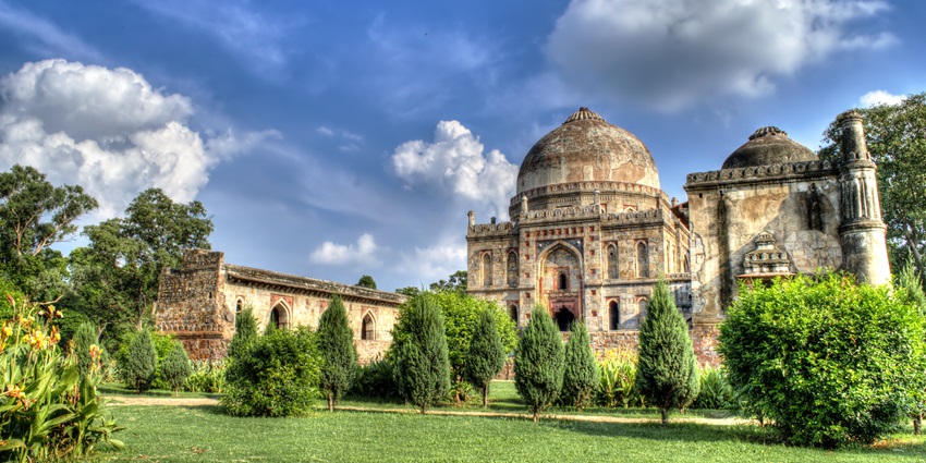 The panoramic picture of the Lodhi Gardens and the historic tomb on a sunny day.