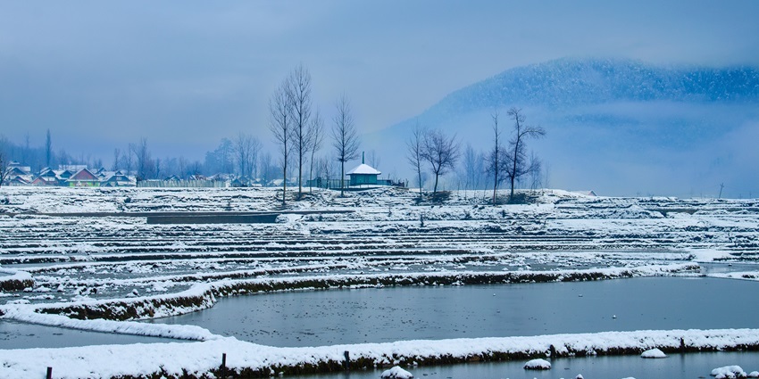 The egg-shaped Lolab Valley is near the Lahwal River and is surrounded by coniferous trees