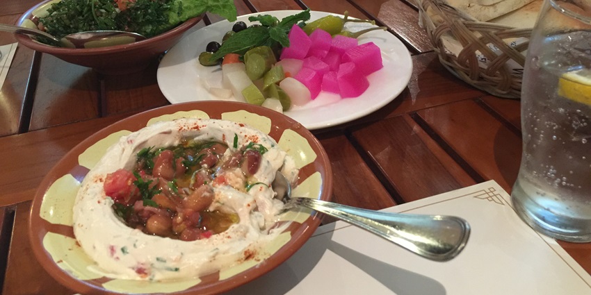 A table full of appetisers, providing a fine dining experience in Dubai