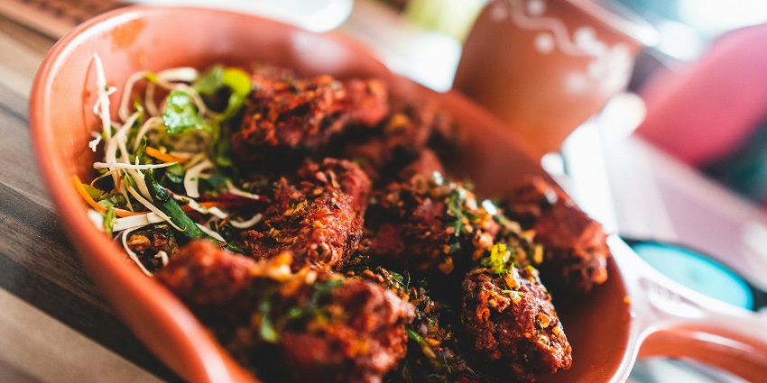 The traditional Emirati delicacy, Madrooba is a must-try famous street food in Dubai.
