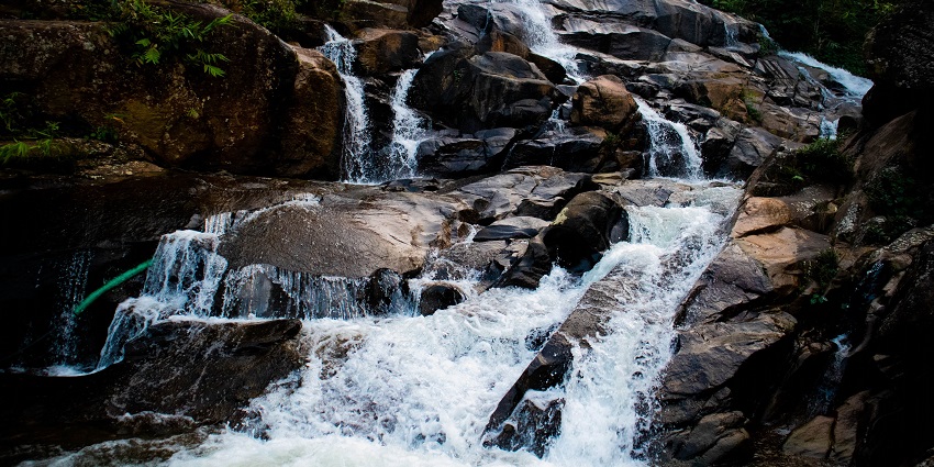 Sparkling water beating down the rock of the waterfall, offering a eye pleasing view