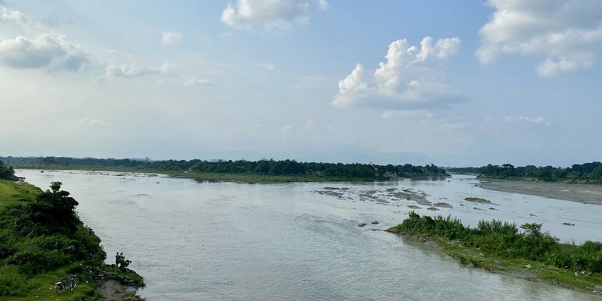 Picturesque view of the river with the blue sky reflecting in the sparkling serene water