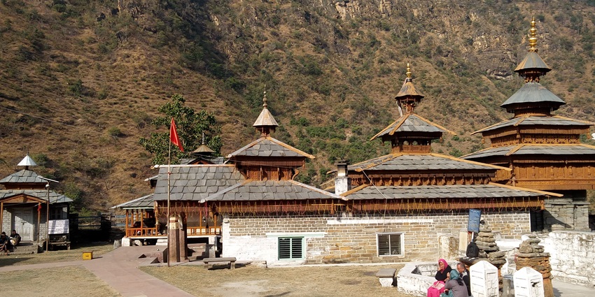 Beautiful snapshot of the Mahasu Devta Temple at the foothills of the green dry hills