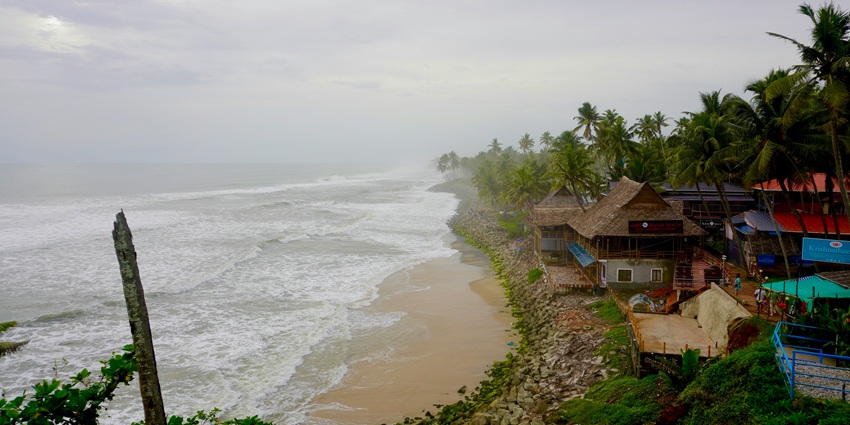 A breathtaking view of Mahe Beach featuring stretches of golden sand and waters.
