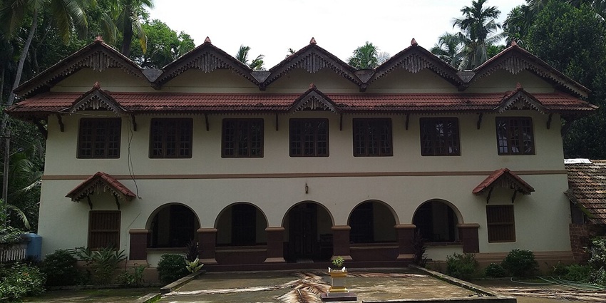 A front view of the Maipady Palace featuring grandeur and a tranquil ambience.