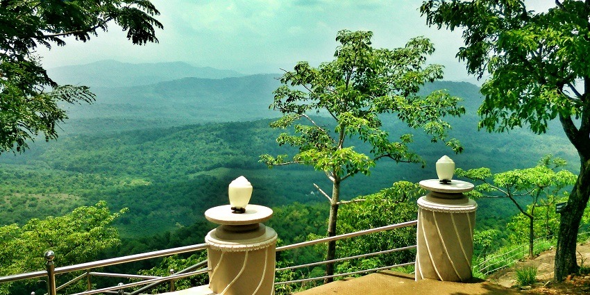 View from the top of Malayattoor Pilgrim site, overlooking lush landscapes and the river.