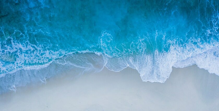 Breathtaking view of a water body with turquoise waters near the seashore during the day.