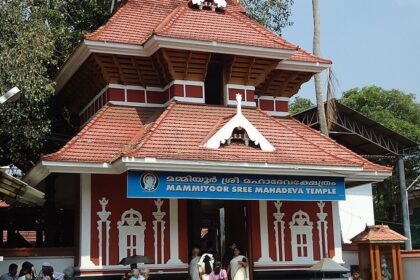 Explore the intricate woodwork and traditional architecture of the Shiva temple in Kerala.