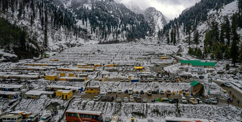 An aerial view of Manali covered in snow during winters, presenting a spectacular view.