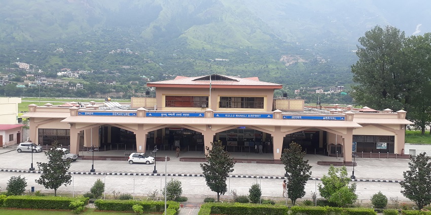 Kullu Manali Airport view with mountains in the background and a clear blue sky.