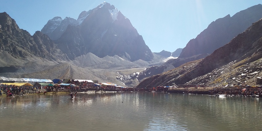 Picturesque view of the lake reflecting the snow covered mountains in its sparkling waters