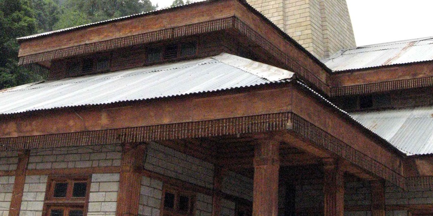 A picture of a towering temple with traditional architecture and intricate walls